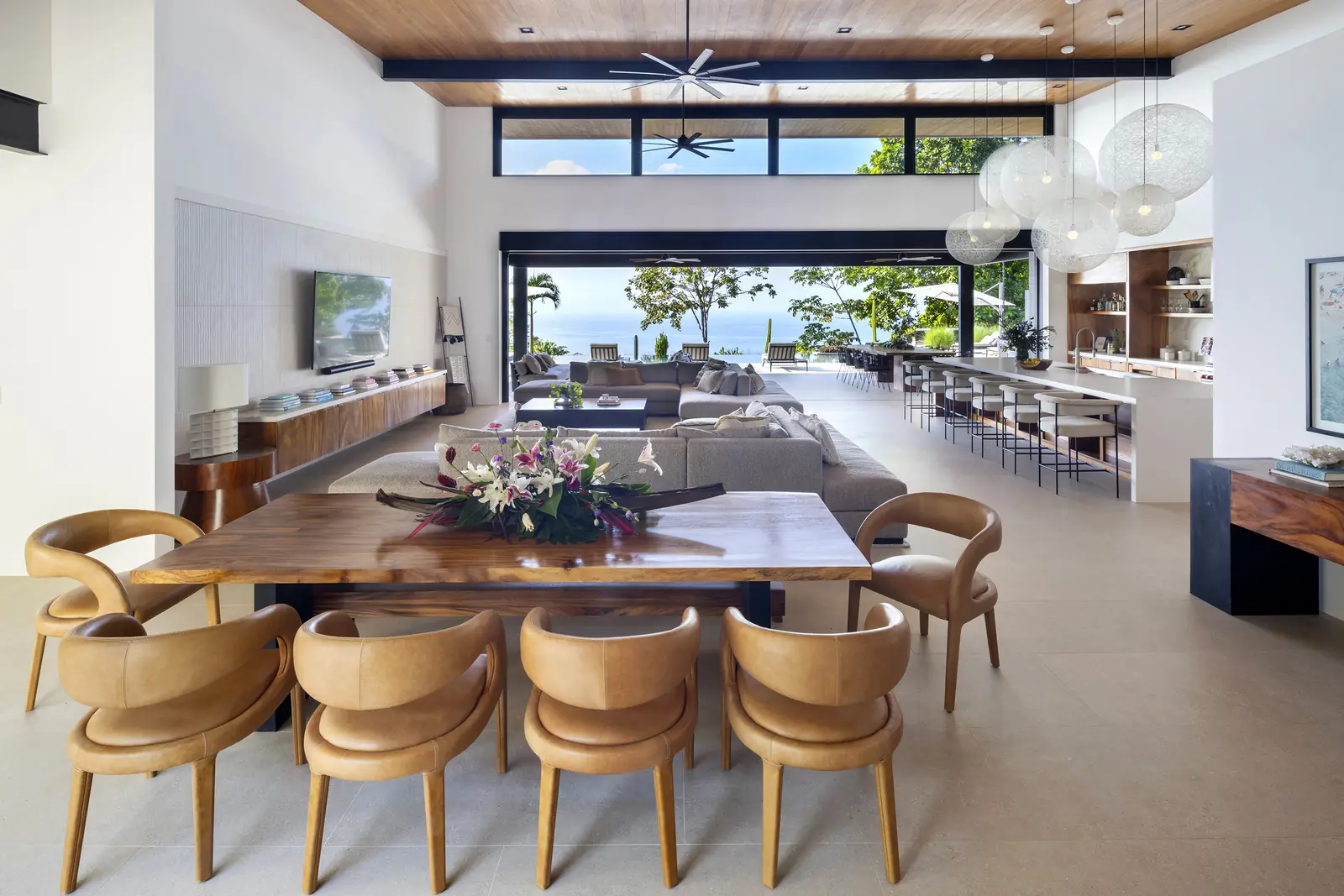 Great room under a teak ceiling, open to the ocean